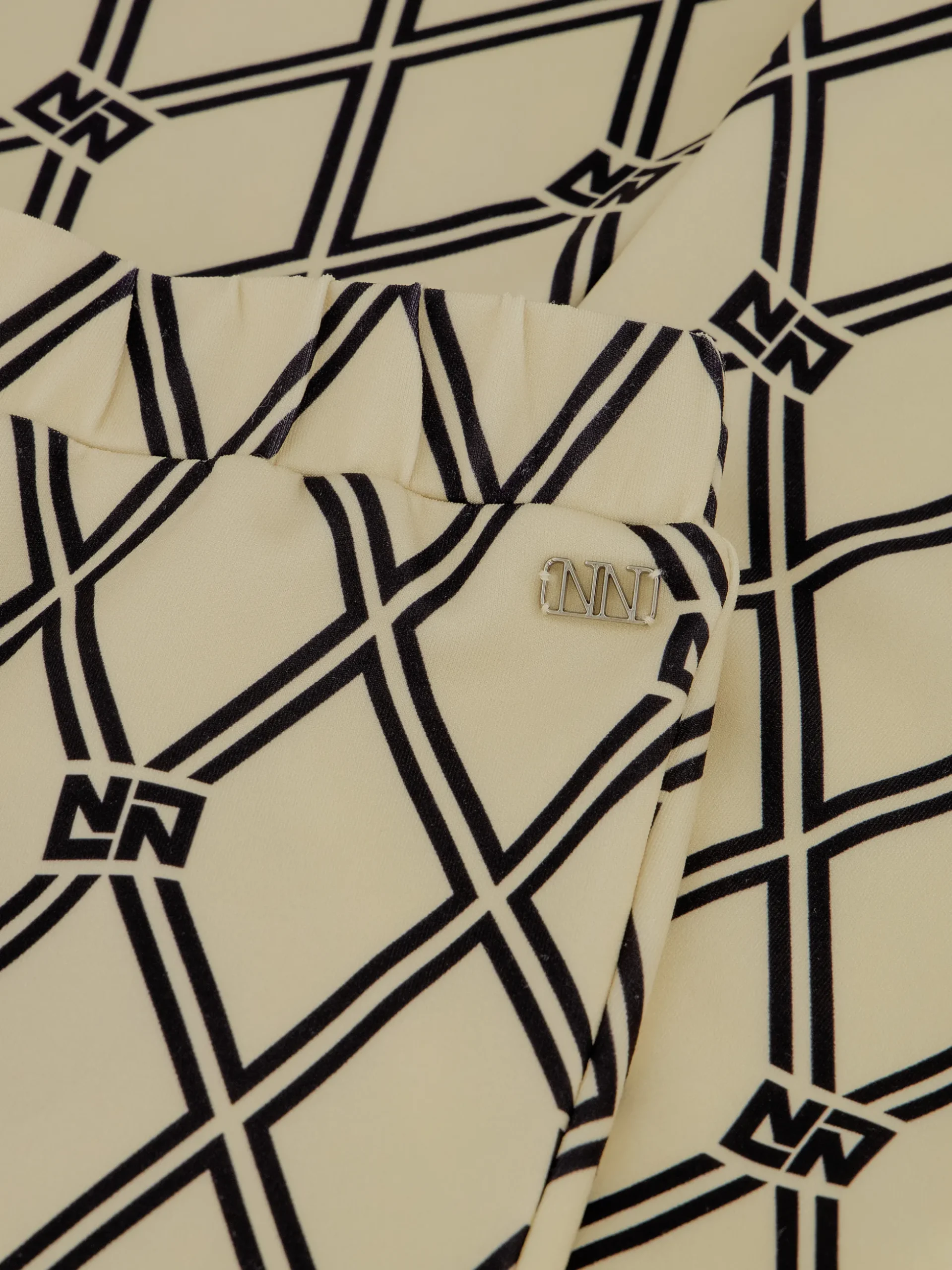 Flared broek met N&N logo patroon