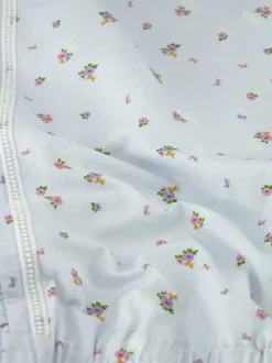 Gelaagde jurk met bloemenprint en ruches