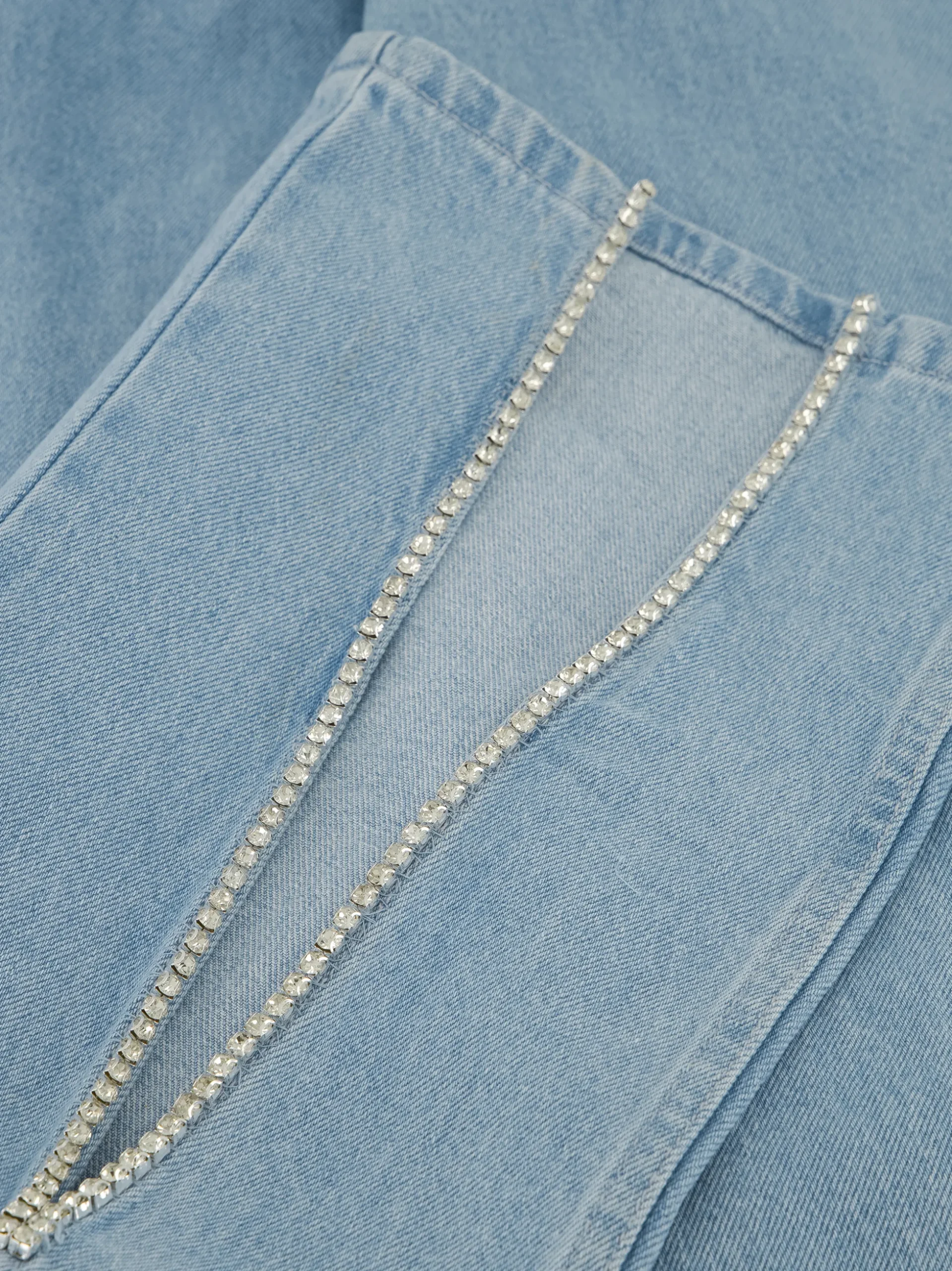 Jeans met split en strass steentjes