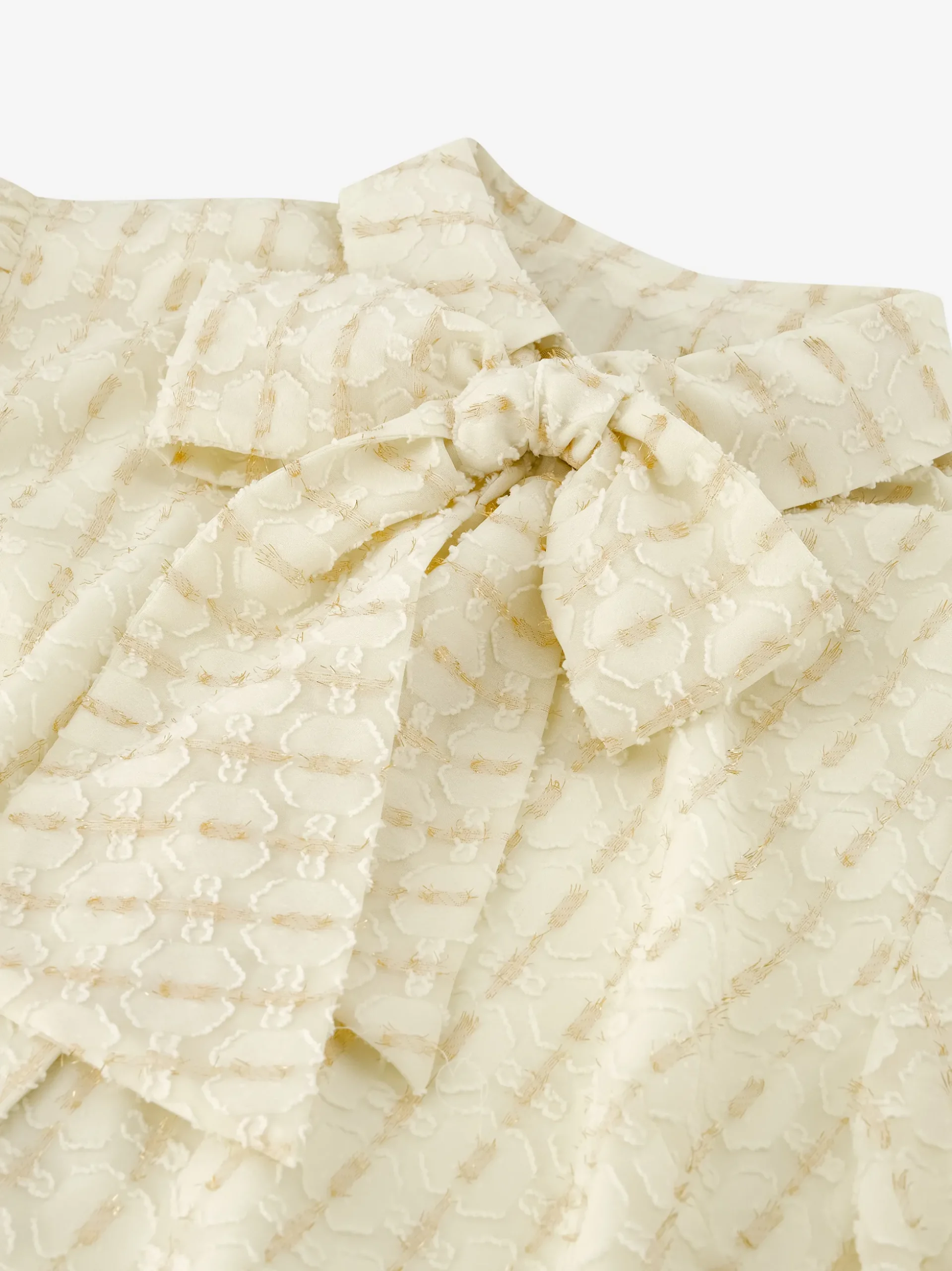 Losvallende blouse met pofmouwen en strikdetail