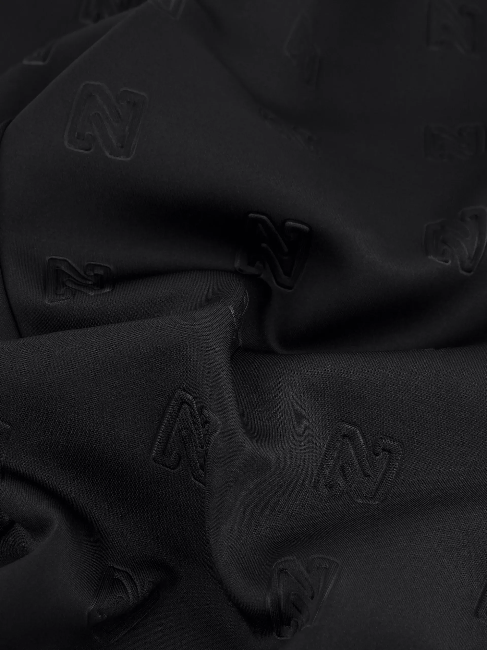 Losvallende broek met logo patroon en sierknopen