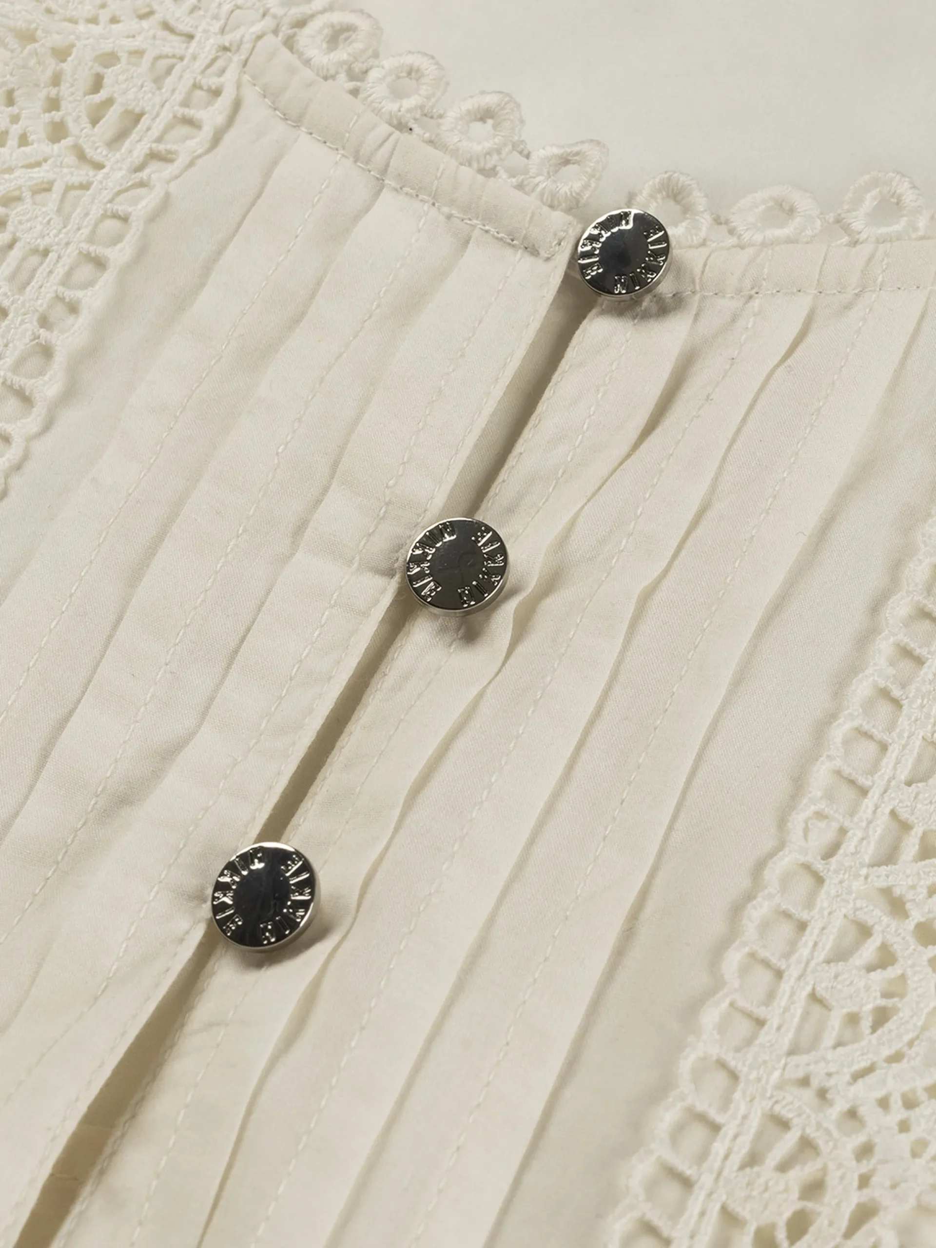 Mouwloze top met volants en broderie