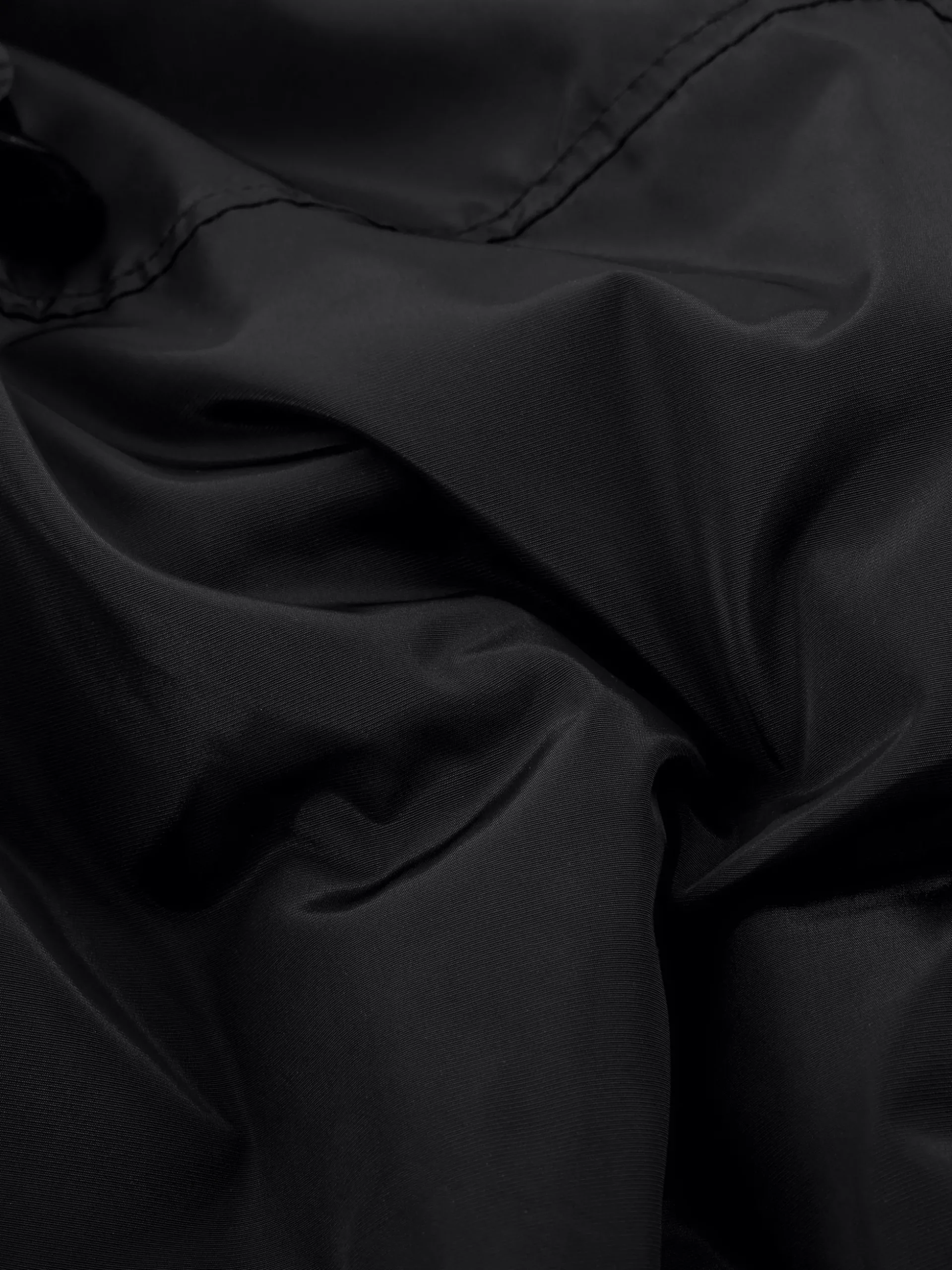 Oversized bomber jack met pailletten en geplooide mouwen