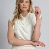 Top met draperende halslijn en rits detail op schouder