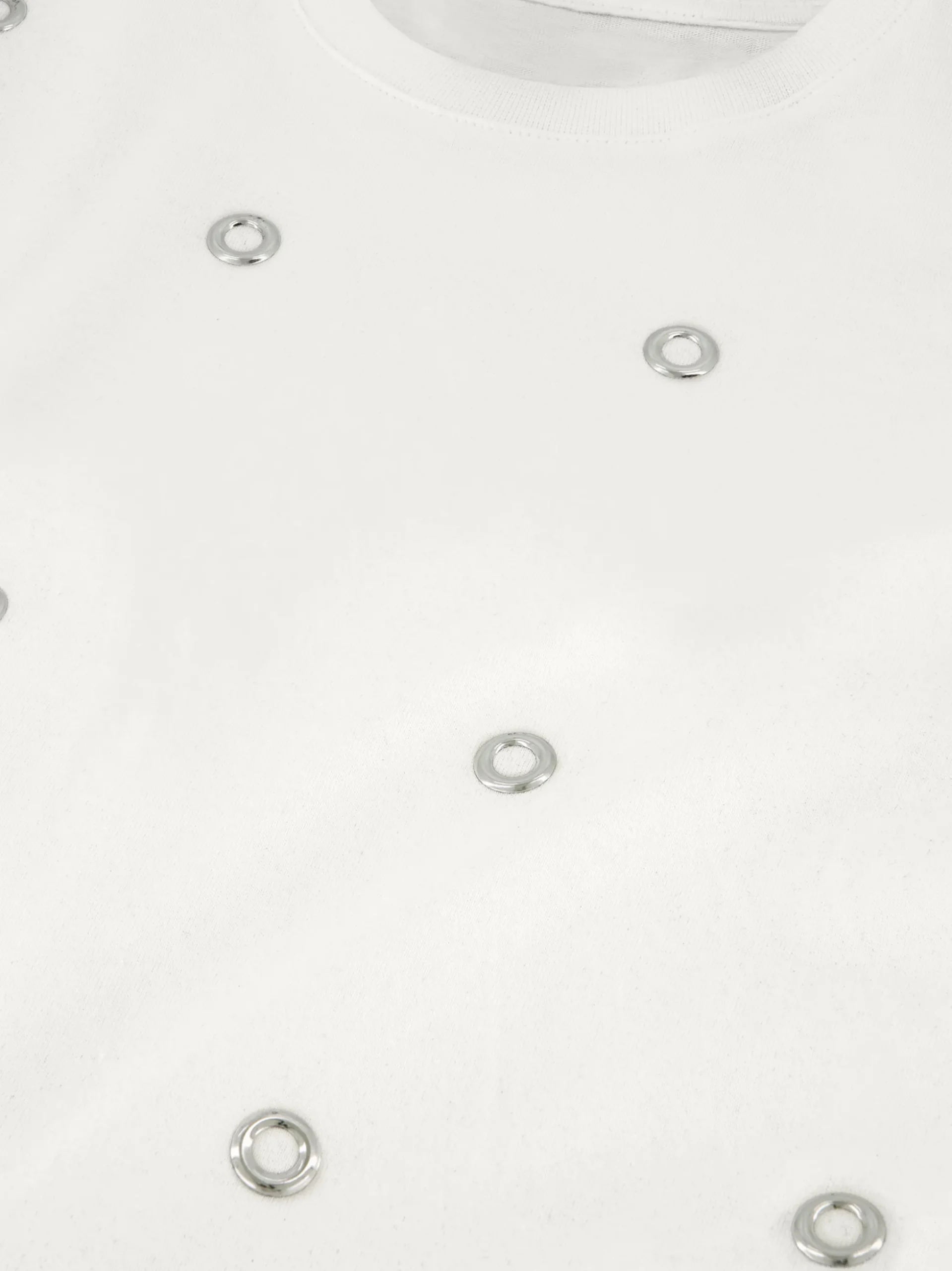 T-shirt met decoratieve ringetjes